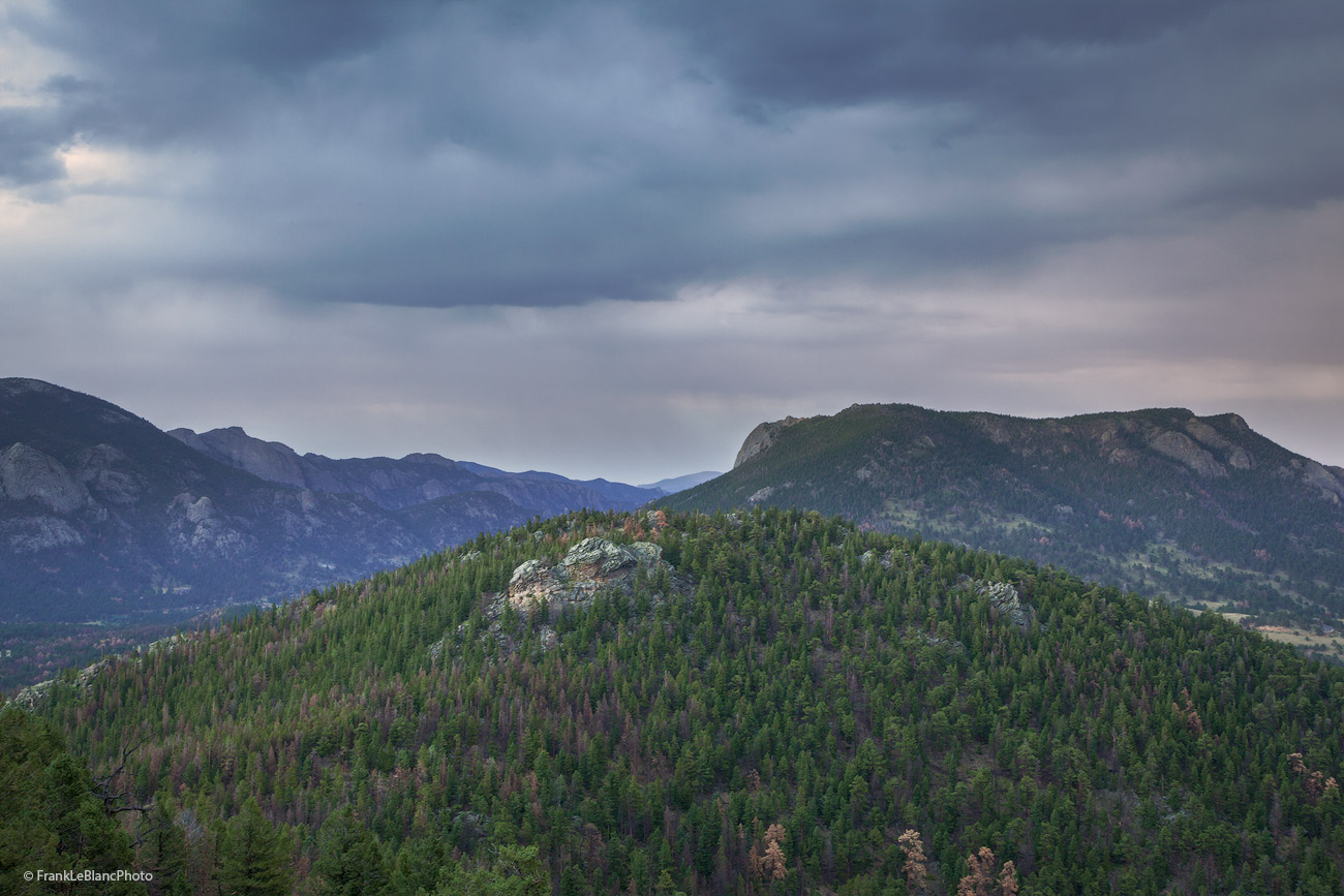 Early morning storm moves over the peaks and valleys of Rocky Mountain National Park from Many Parks Curve.