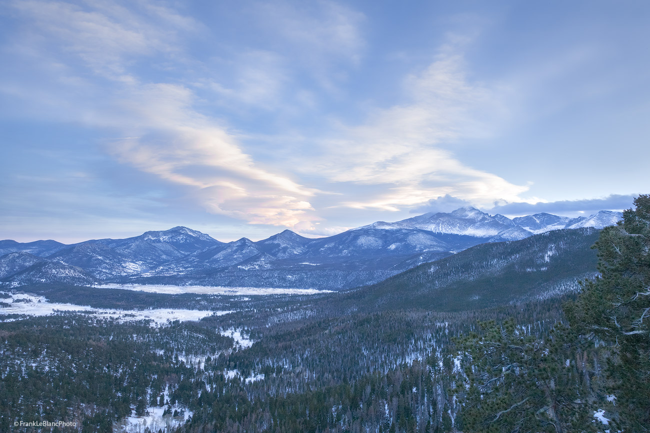 Lenticular clouds break up and spread out over Longs Peak, Mt. Meeker and the other high peaks of the front range. The view is...