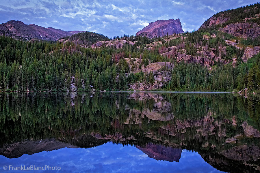 August sunrise through dense cloud cover,&nbsp;Reflections of Hallett peak&nbsp;