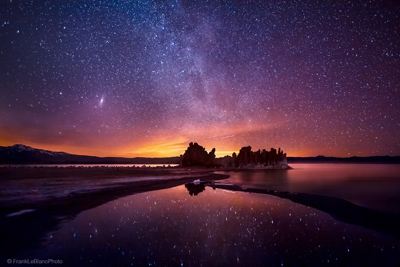The lights of Bridgeport, California illuminate the north side of Mono Lake while the milky way provides stars in all directions...
