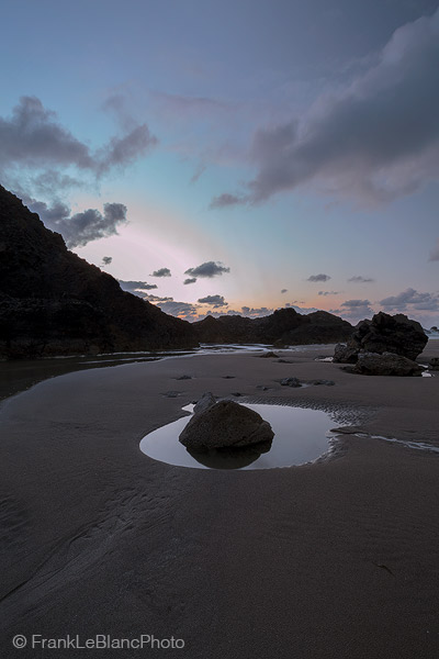 A still-life waiting for the moment when waves will crash over the rocks and cover these inscriptions forever.
