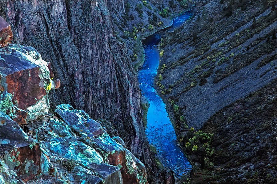 The Gunnison river makes its way among the steep vertical walls and escarpments of the Black Canyon which it sculpted over millions...