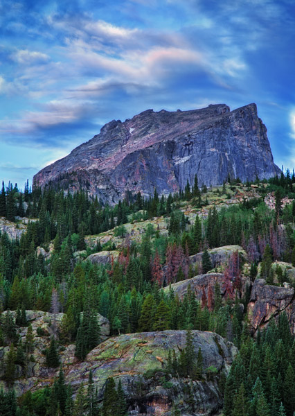 View from Bear Lake. Boulders shape the route to the tilted talus slope to the highpoint. North face of Hallett peak in summer...