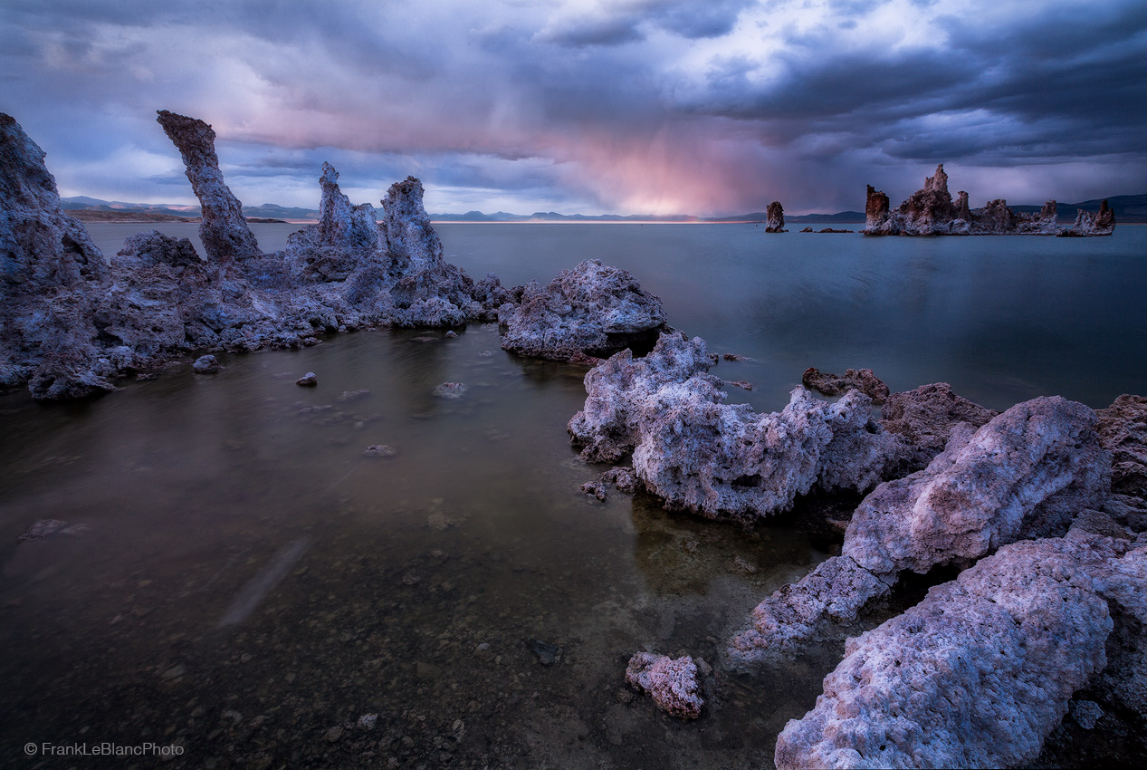 Storm clouds roll off the Sierra Nevada mountains and descend to Mono Lake below . Mono Lake is a tidal lake so the water begins...